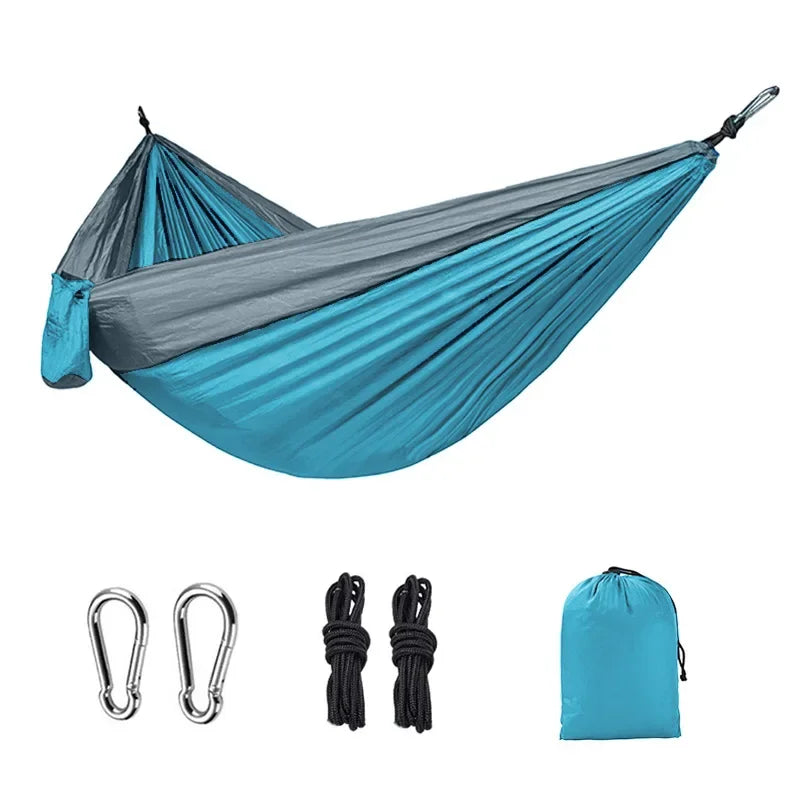 Sky blue and gray camping hammock with carabiners, ropes and storage bag