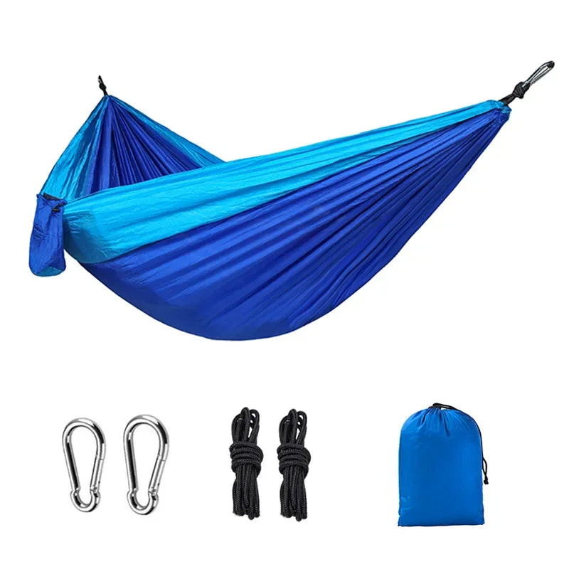 Royal blue and sky blue camping hammock with carabiners, ropes and storage bag