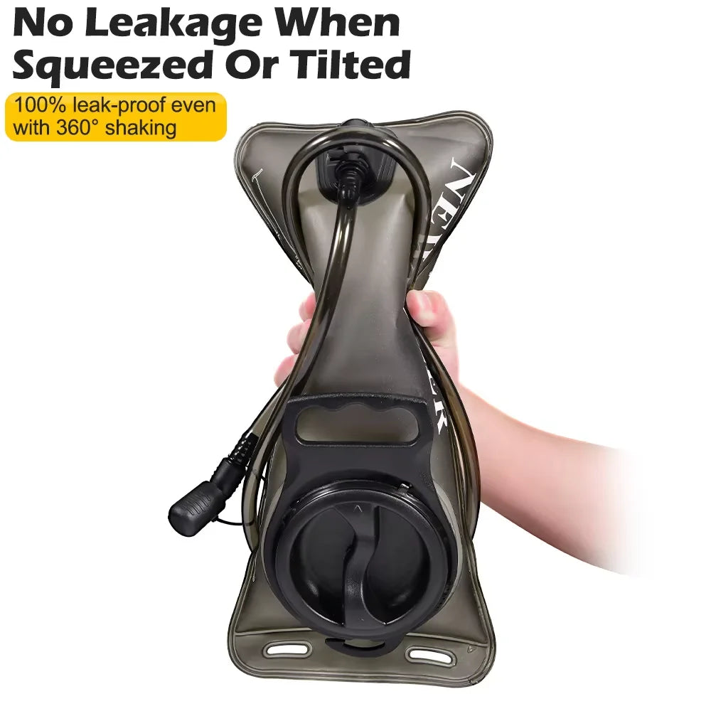 Hand squeezing a filled hydration bladder held upside down