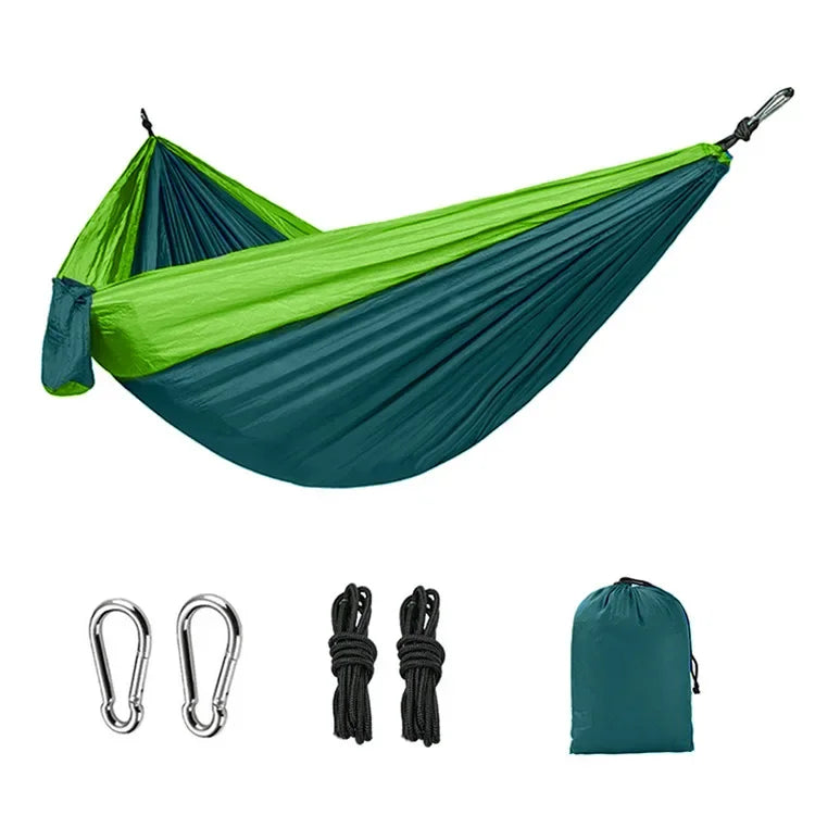 Lime green and teal camping hammock with carabiners, ropes and storage bag