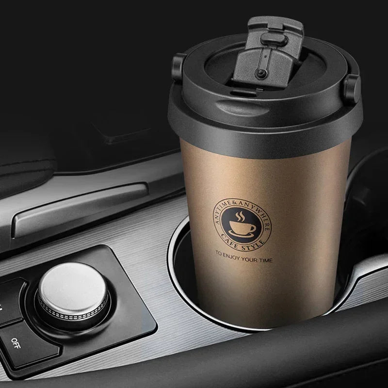 Gold travel mug in a car cup holder