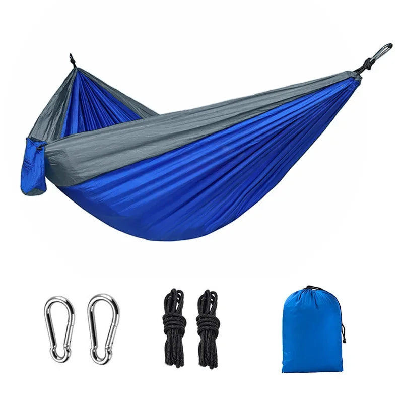 Blue and gray camping hammock with carabiners, ropes and storage bag