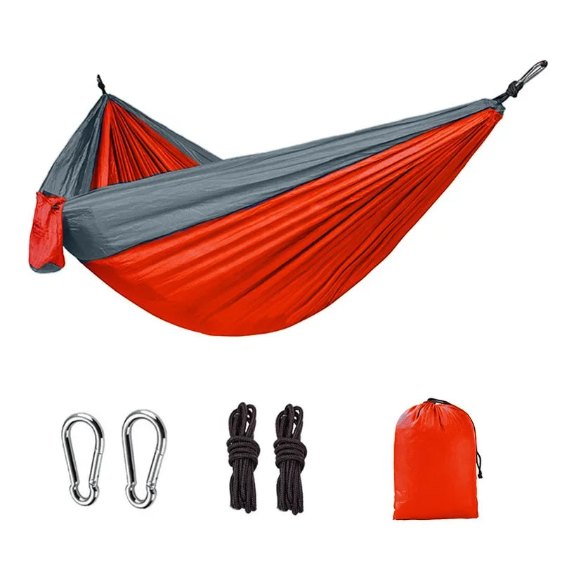 Orange and gray camping hammock with carabiners, ropes and storage bag