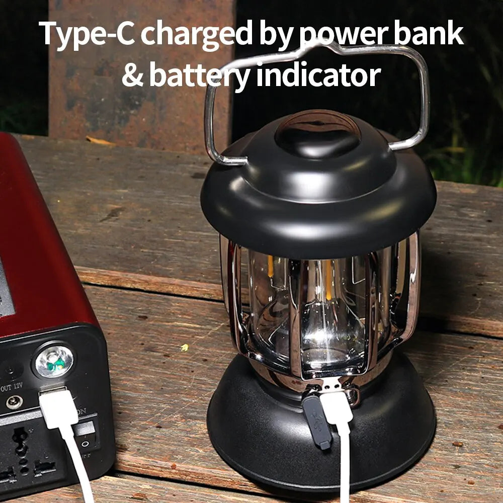 Black LED lantern charging from a power bank over USB-C