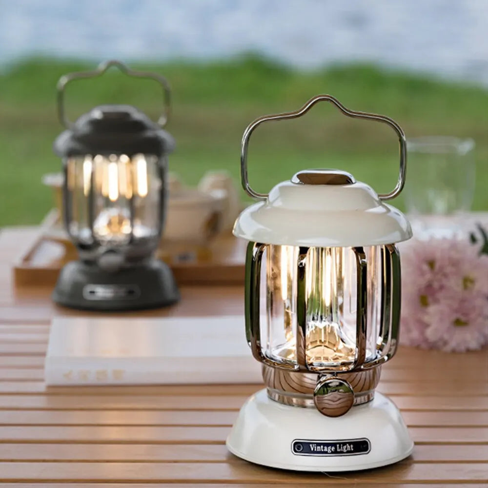 White and black retro LED lanterns on an outdoor table