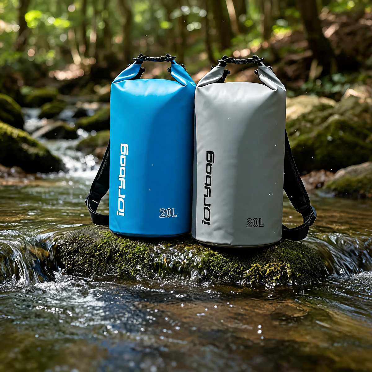 Blue and gray dry bags standing beside a forest stream